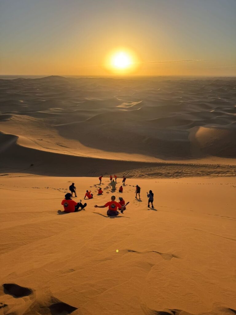 Sliding down the highest dune in the Moroccan Sahara – Erg Chigaga