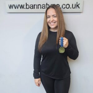 Nicola Sparkes holding a medal