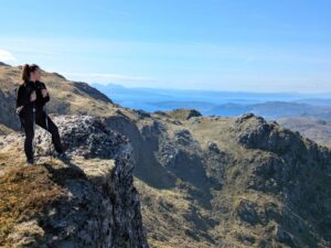Picture of Nicola, training for the fundraiser, standing on some mountains